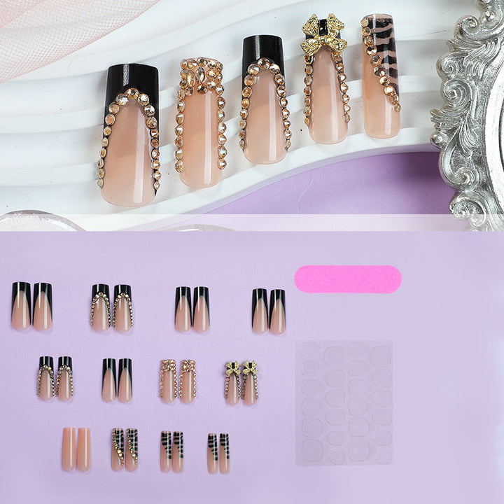 Acrylic nail set with glamorous 3D bows and radiant rhinestone decorations Stornfield