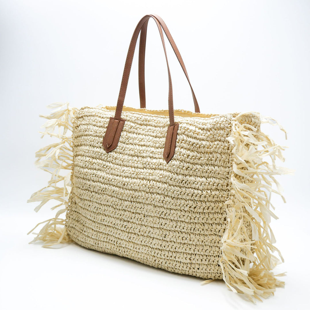 Beach bag made of handwoven straw with fringes Stornfield