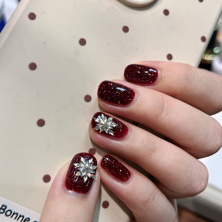 Glamorous artificial nails with rhinestone applications Stornfield