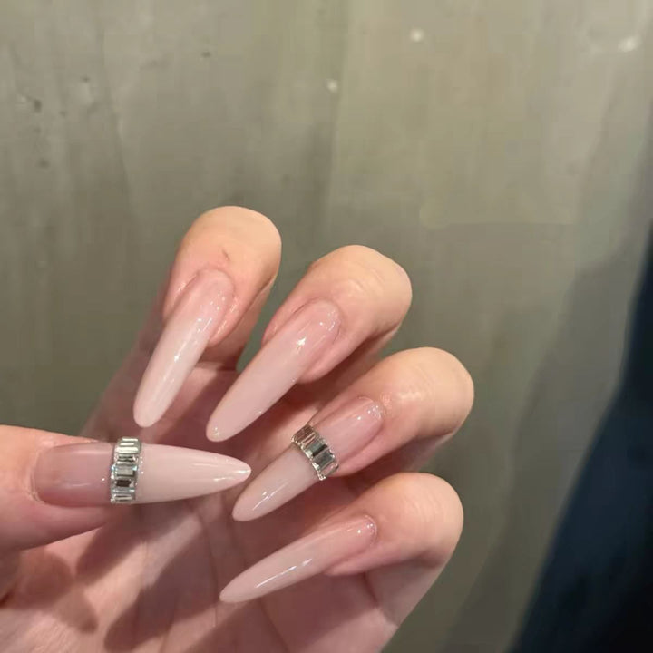 Elegant Stiletto Nail Extensions with Crystal Accents
