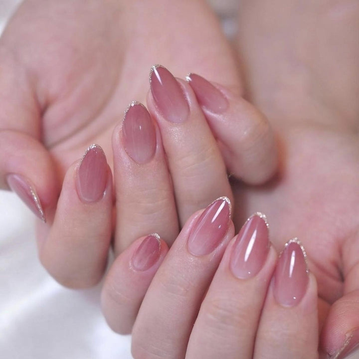 Elegant Stiletto Nail Extensions with Glittering French Tips Stornfield