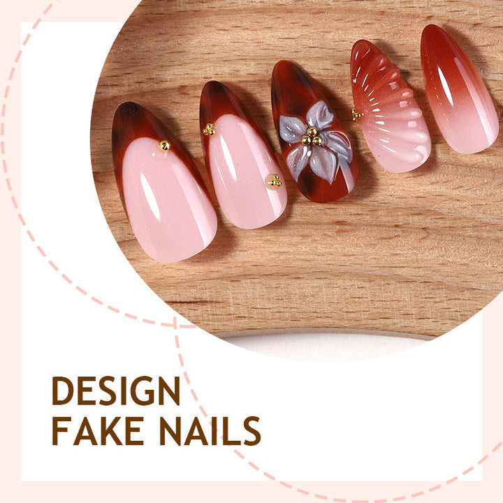 Nail art set with detailed ombre design and creative flower accents Stornfield