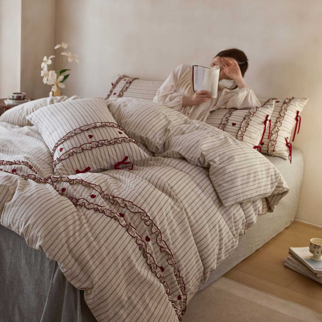 Striped bedding set with ruffles and heart applique