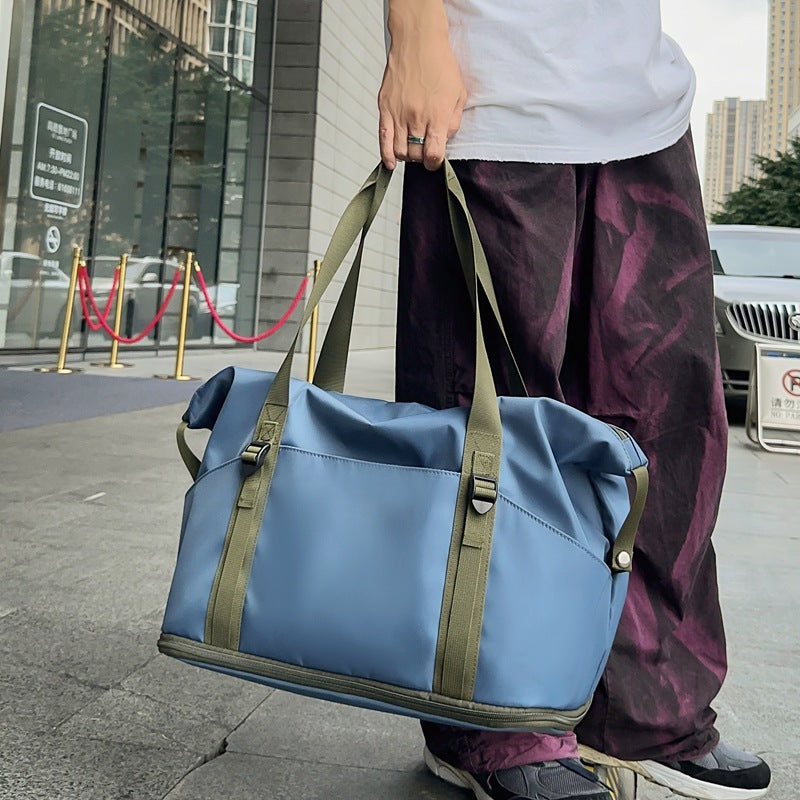 Sporty shoulder bag with water-repellent material and sturdy carrying handles Stornfield