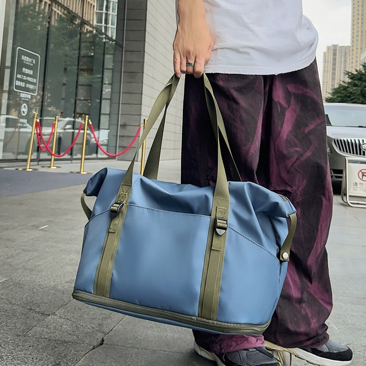 Sporty shoulder bag with water-repellent material and sturdy carrying handles Stornfield