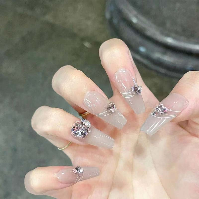 Art nail set with filigree decorations and glamorous accents Stornfield