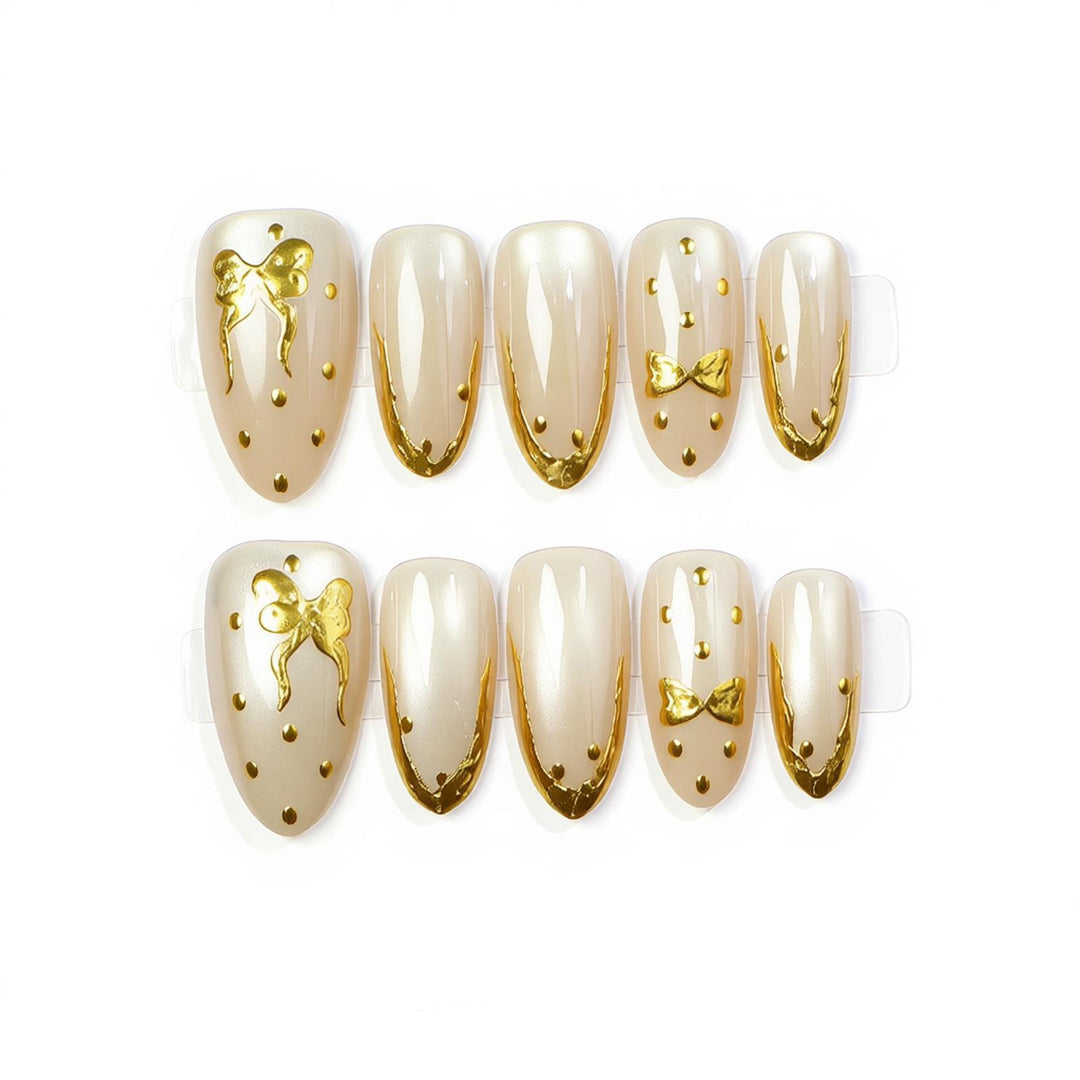 Elegant Press-On Nail Art with Golden Bow Accents Stornfield