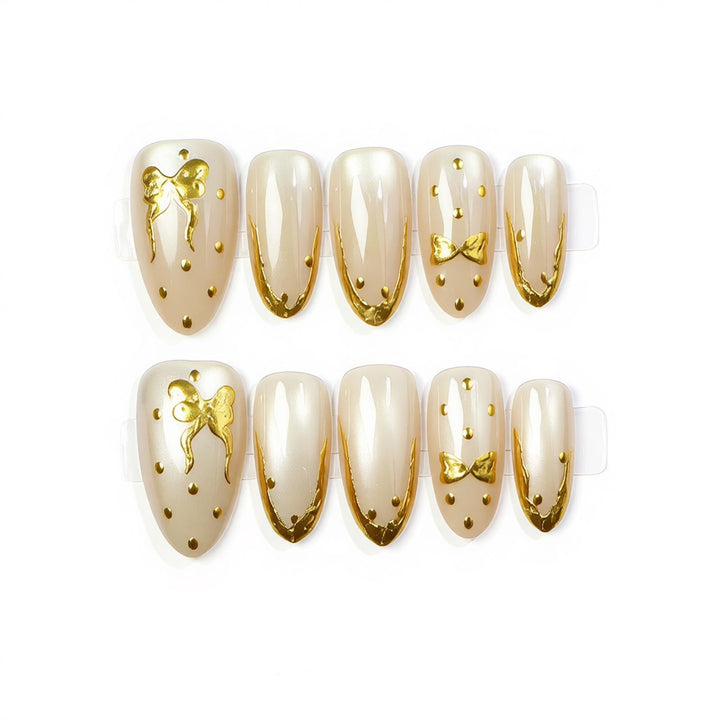 Elegant Press-On Nail Art with Golden Bow Accents Stornfield