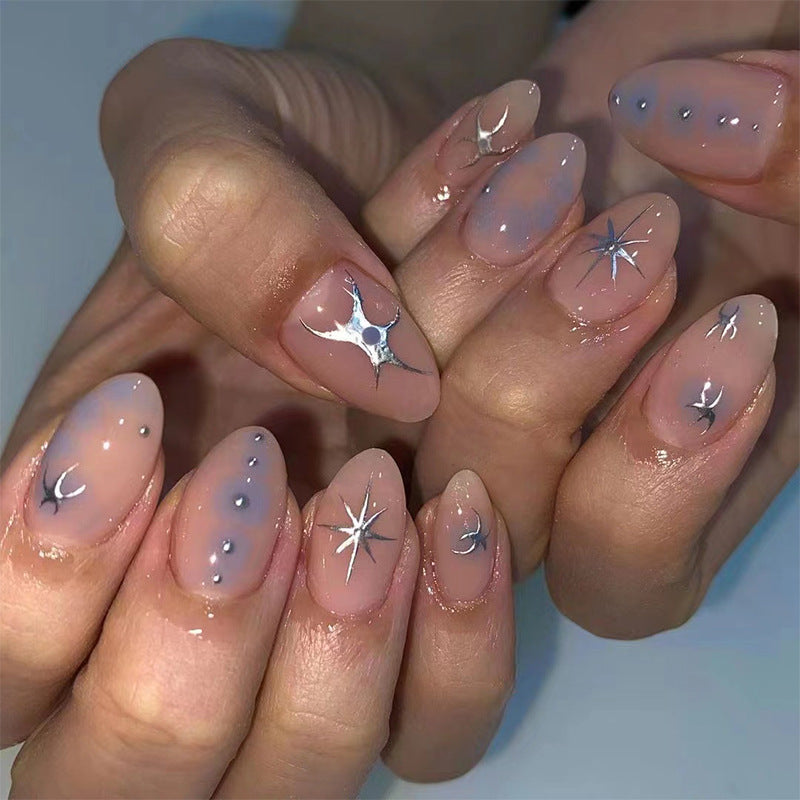 Elegant nail art with glamorous metal embellishments Stornfield