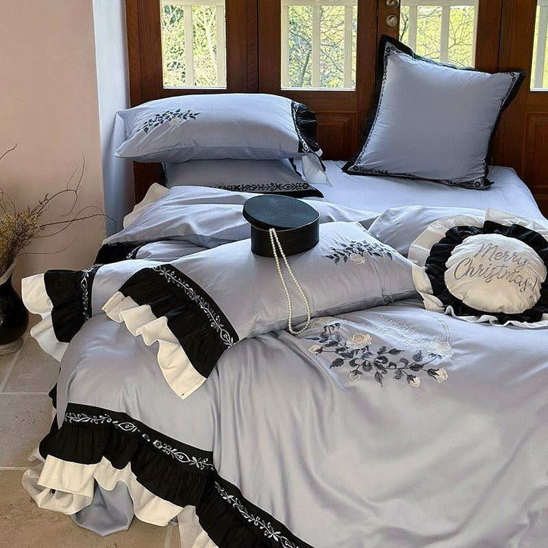 Elegant bed linen set made of cotton satin with embroidery, contrasting frill and round cushion