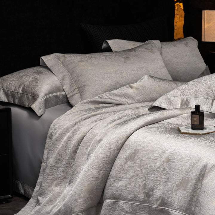 Luxurious satin bedding set with structured crocodile embossing and hotel closure