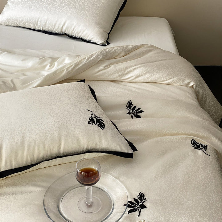 Reversible Jacquard Sateen Duvet Cover Set with Minimalist Botanical Embroidery and Contrast Piped Shams