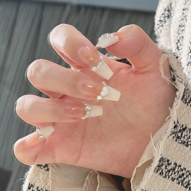 Artificial nail set with elegant flower and glitter decorations Stornfield