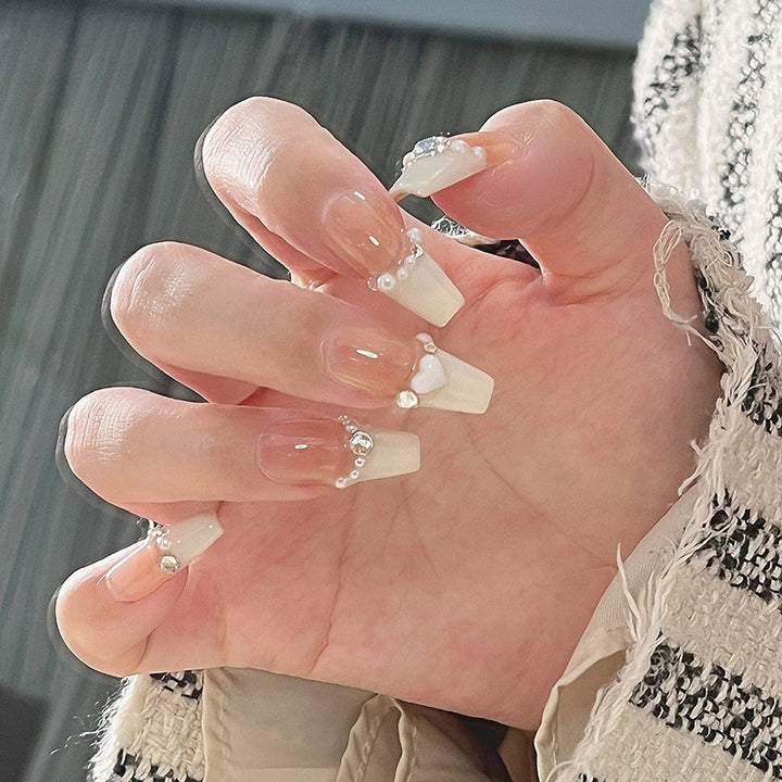 Artificial nail set with elegant flower and glitter decorations Stornfield
