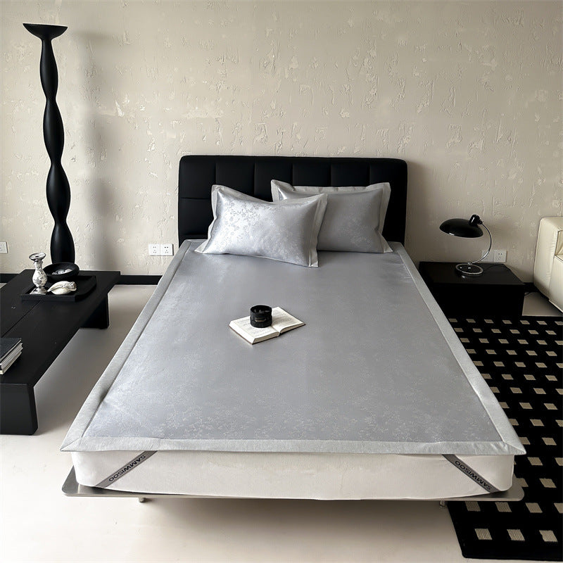 high-quality non-slip mattress protector with integrated fitted sheet and elegant jacquard pattern
