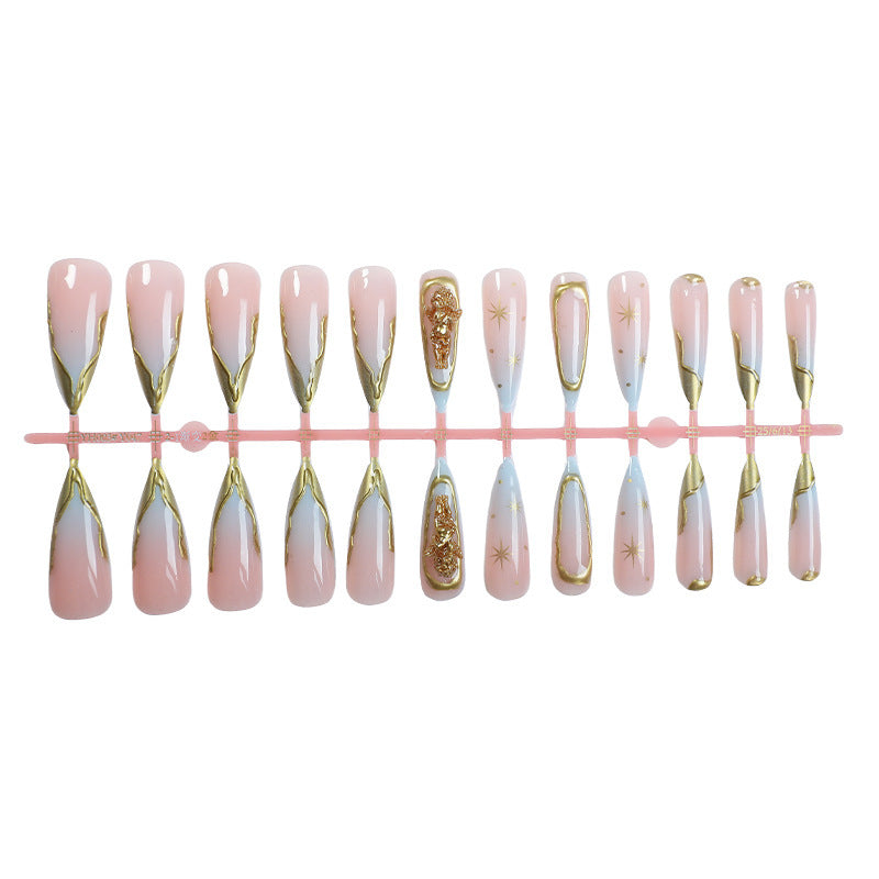 Artificial Nail Set with delicate golden accents and glitter motifs Stornfield