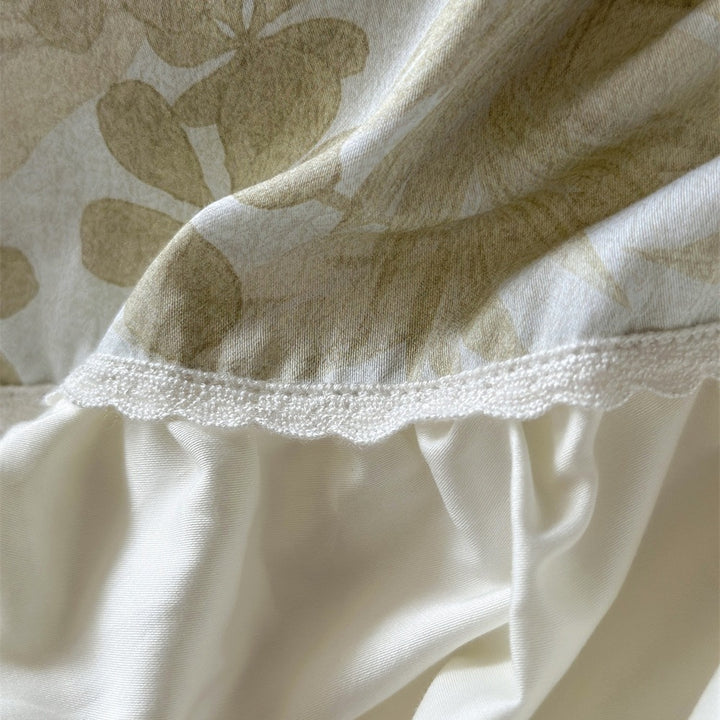 Luxurious jacquard bedding set with ruffled frill, satin trim, and decorative pillows