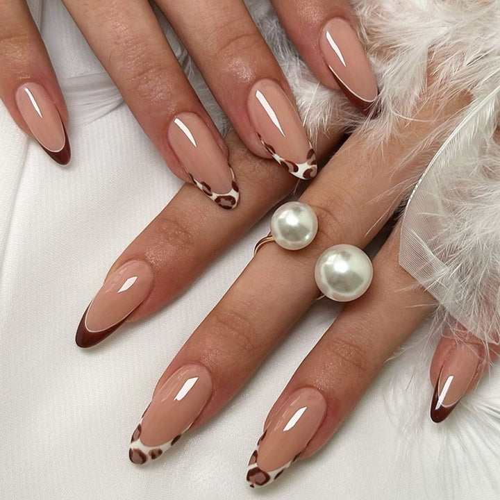 Nail art set with leopard pattern and glitter embellishments Stornfield