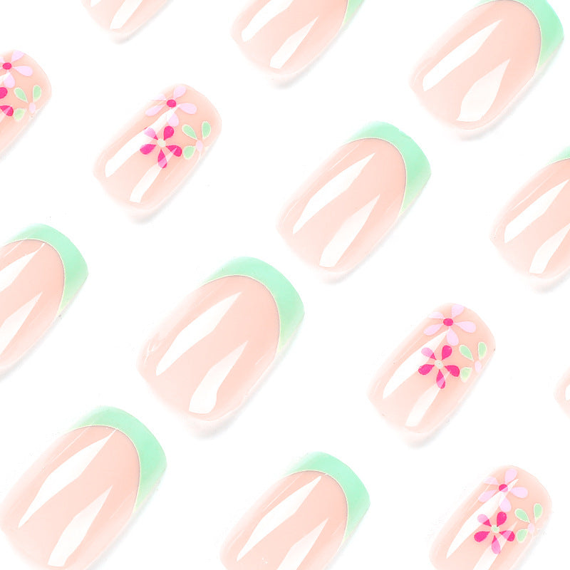 Artificial nails with floral accents and neon tips Stornfield