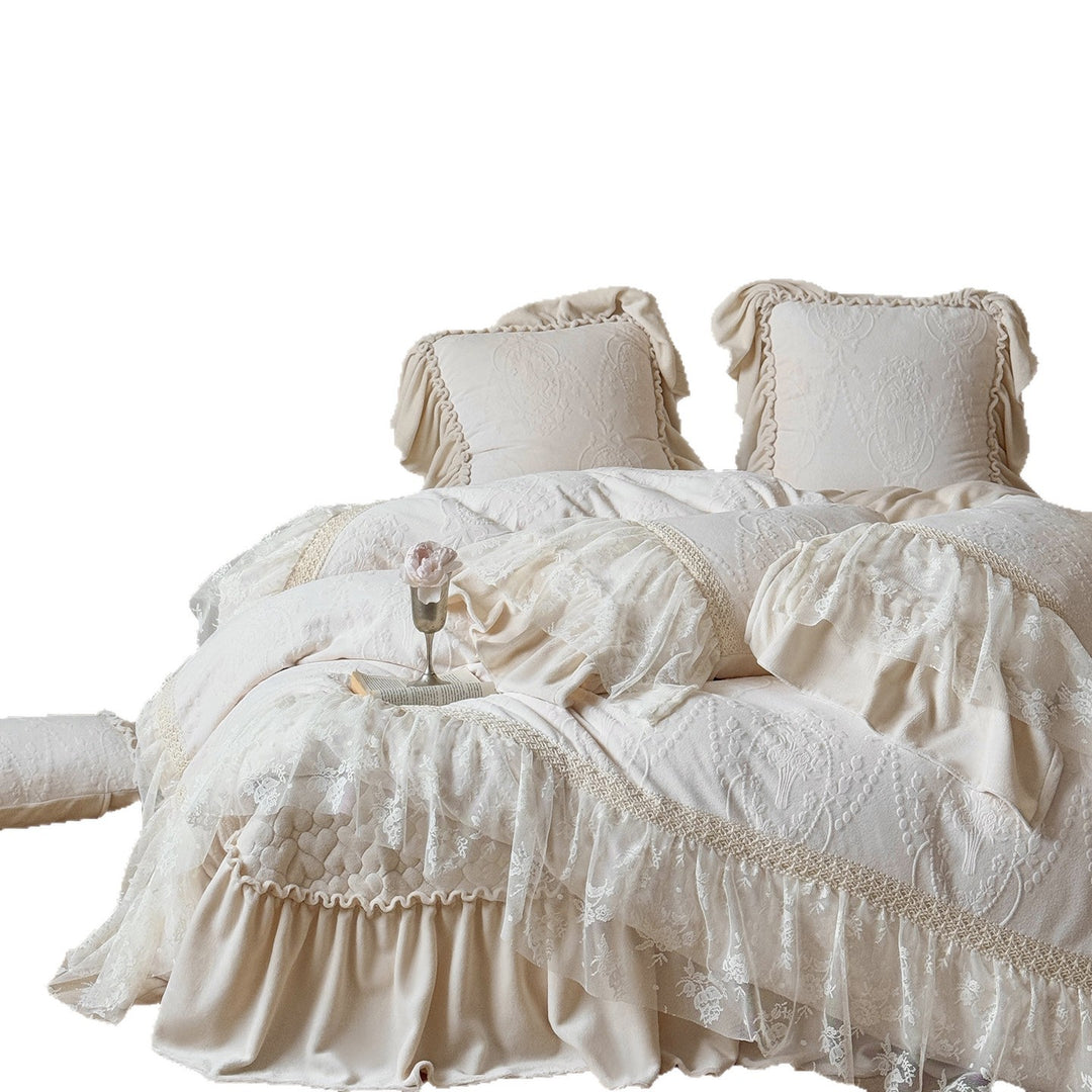 Romantic bedding set with lace trim, ruffle, and quilted blanket
