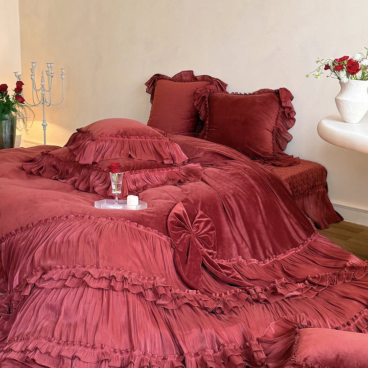 Romantic ruffled velvet bed set with pleated frills and decorative cushions