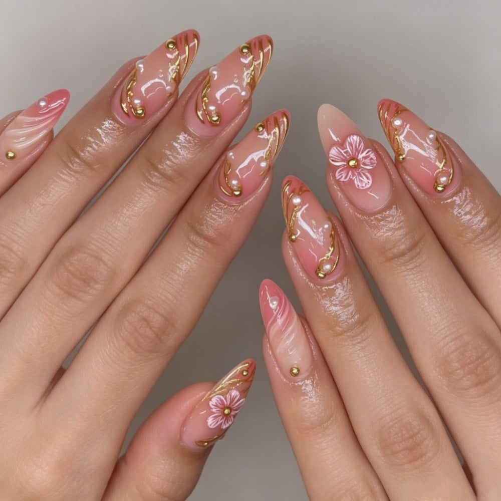Artificial nails with floral decorations and gold accents Stornfield