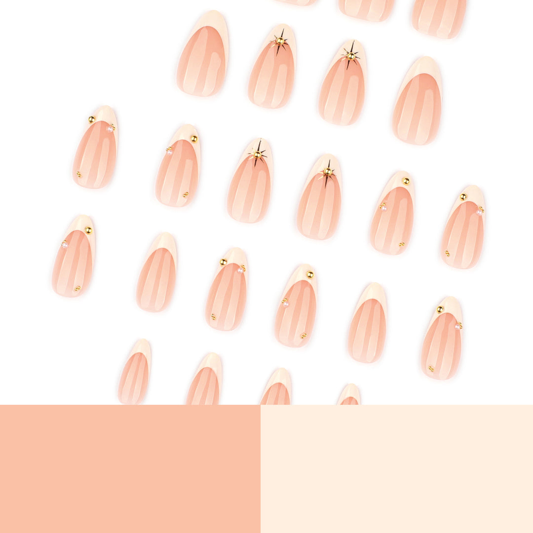 Artistic French-tip nail art with glitter and elegant embellishments Stornfield