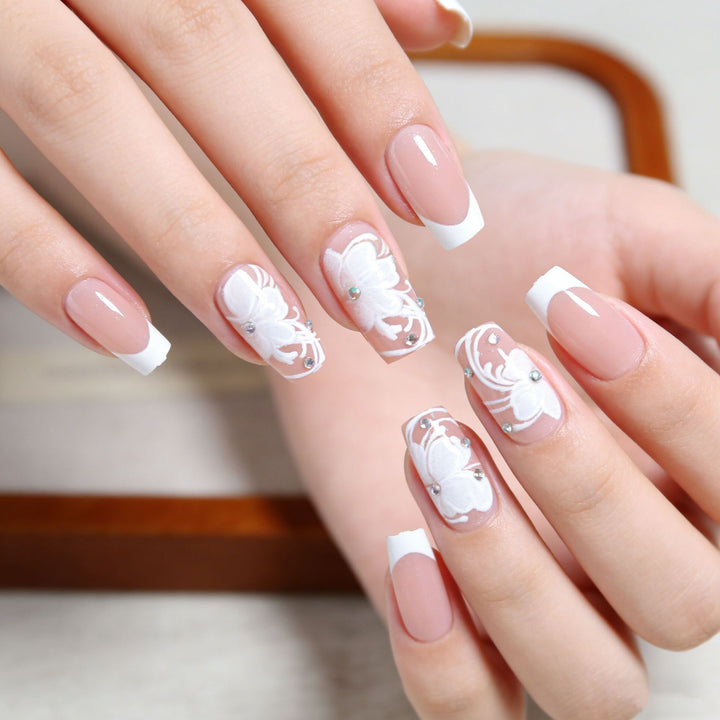 Artificial nails with floral embellishments and glitter details Stornfield