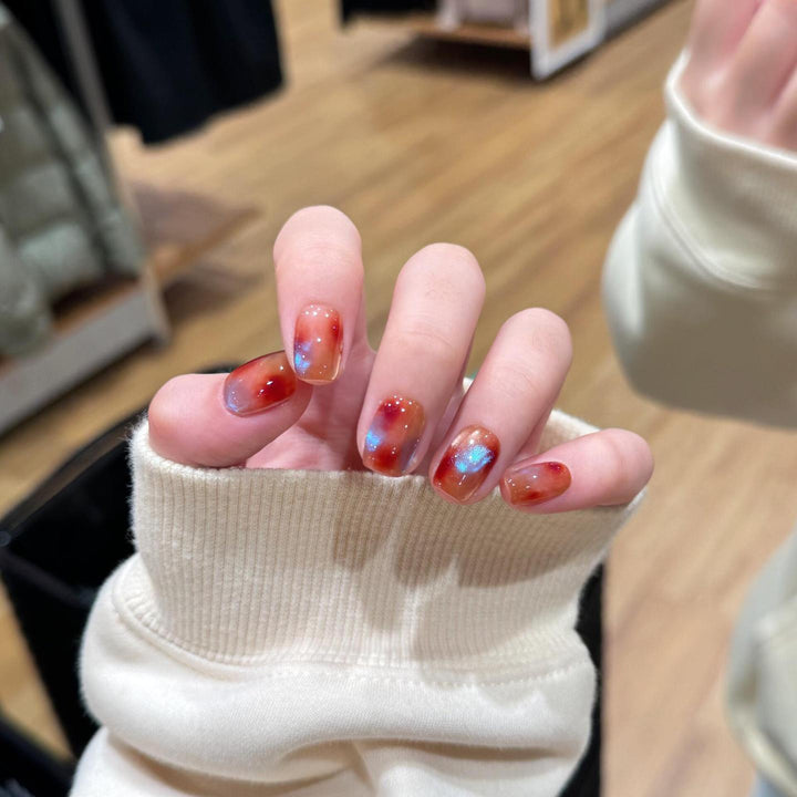 Artificial nails with shimmering galaxy patterns Stornfield