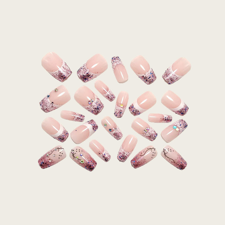 Glamorous artificial nails with glitter and rhinestone embellishments Stornfield