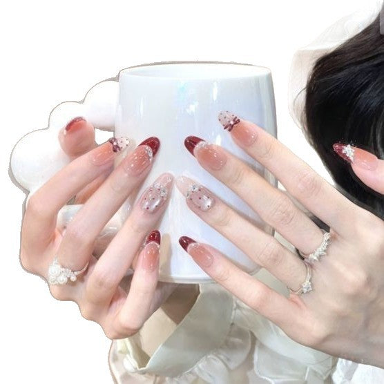 Artistic Stiletto Nail Enhancements with Decorative Accents