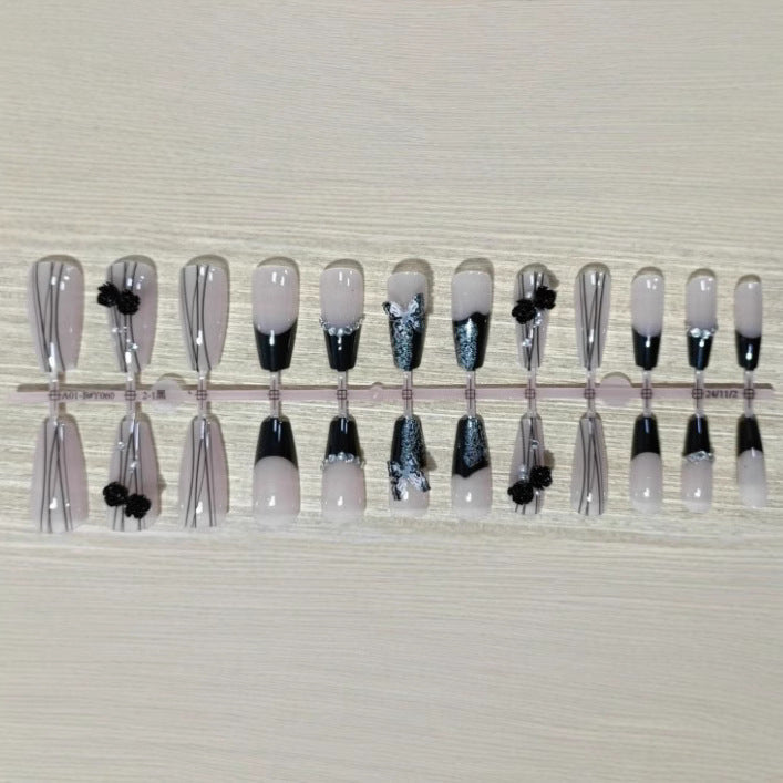 Elegant nail design with bow and rhinestone details Stornfield