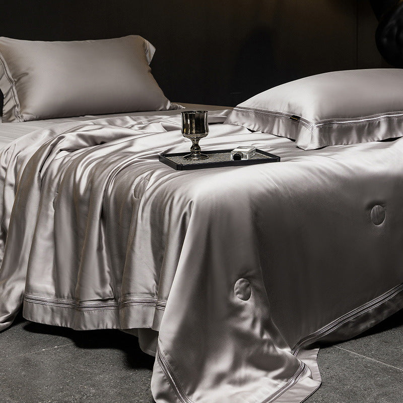 Luxurious satin bed set with silk-like surface and fine decorative stitching