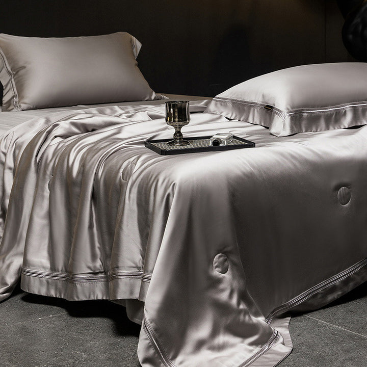 Luxurious satin bed set with silk-like surface and fine decorative stitching