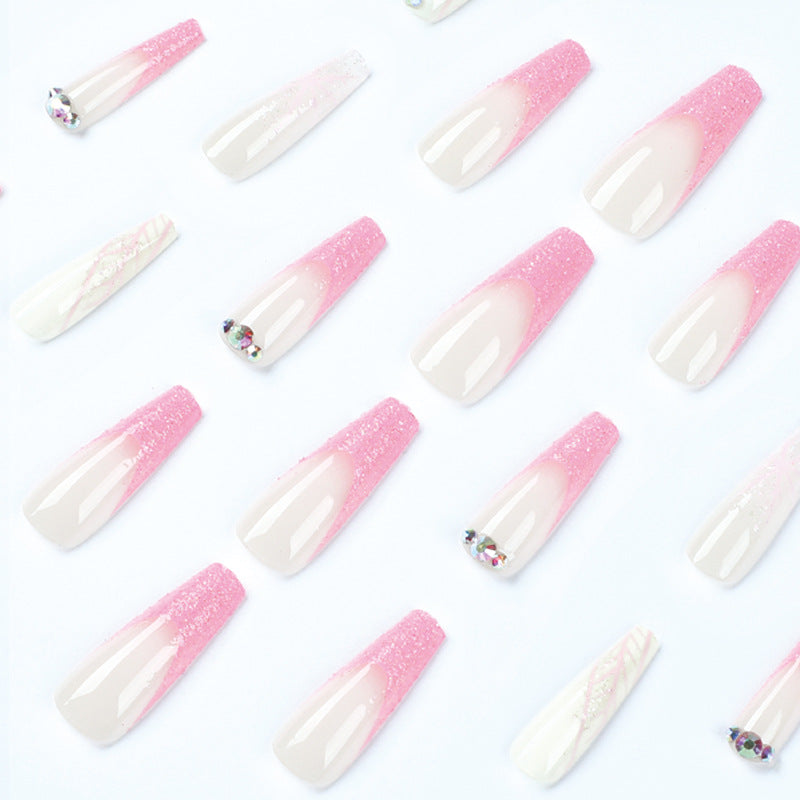 Artistic stiletto nails with glitter and snowflake design Stornfield