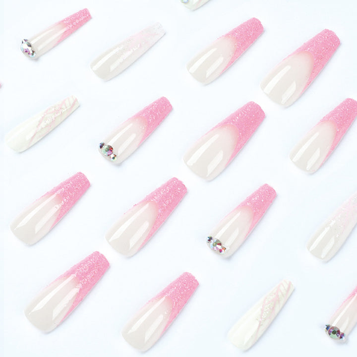 Artistic stiletto nails with glitter and snowflake design Stornfield