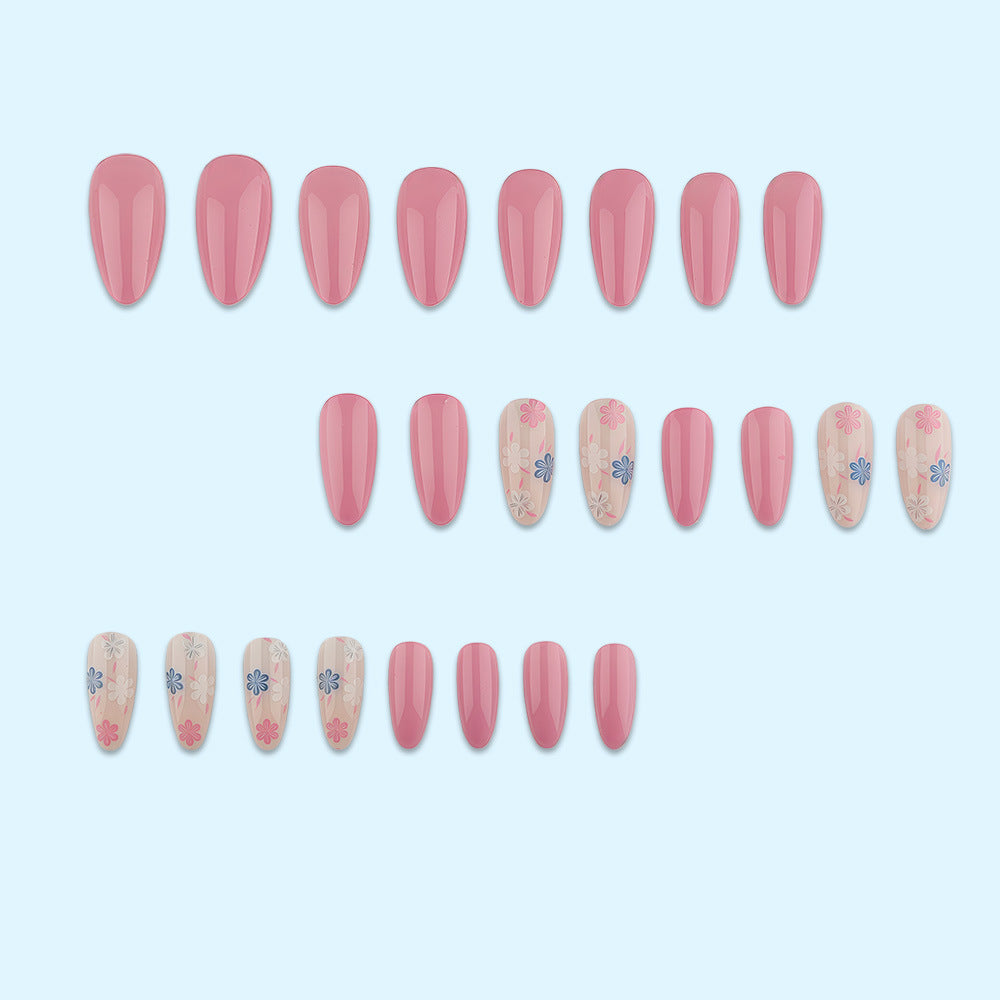 Stylish almond-shaped artificial nails with floral patterns Stornfield