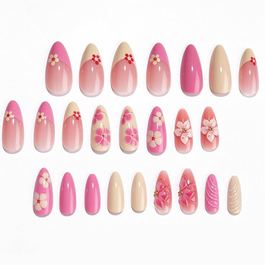 Artificial nail set with floral accents and glitter elements Stornfield