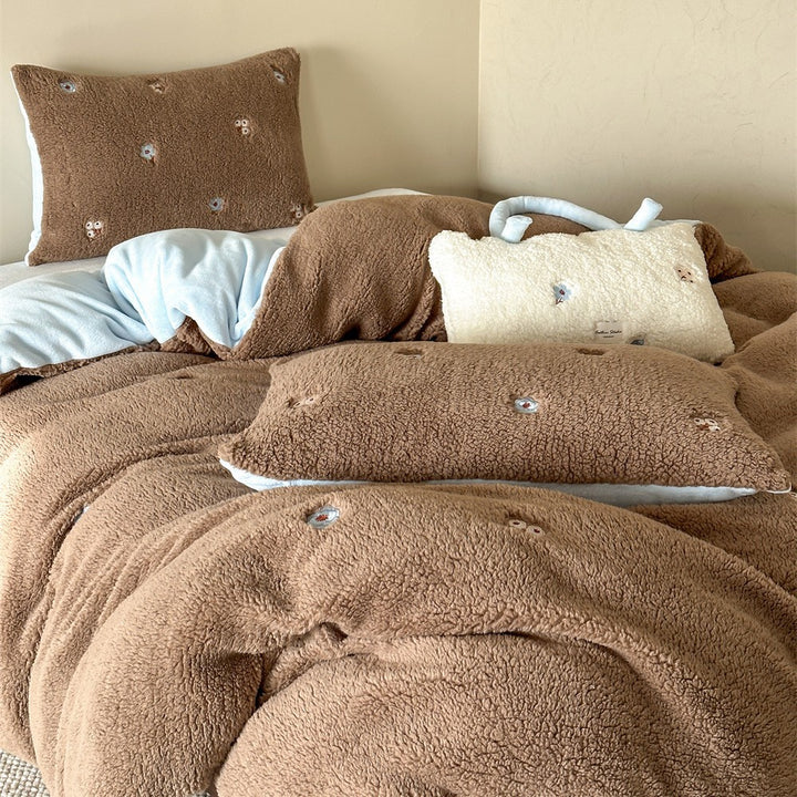 Sherpa bed blanket and reversible bed cover with embroidered flower appliqués