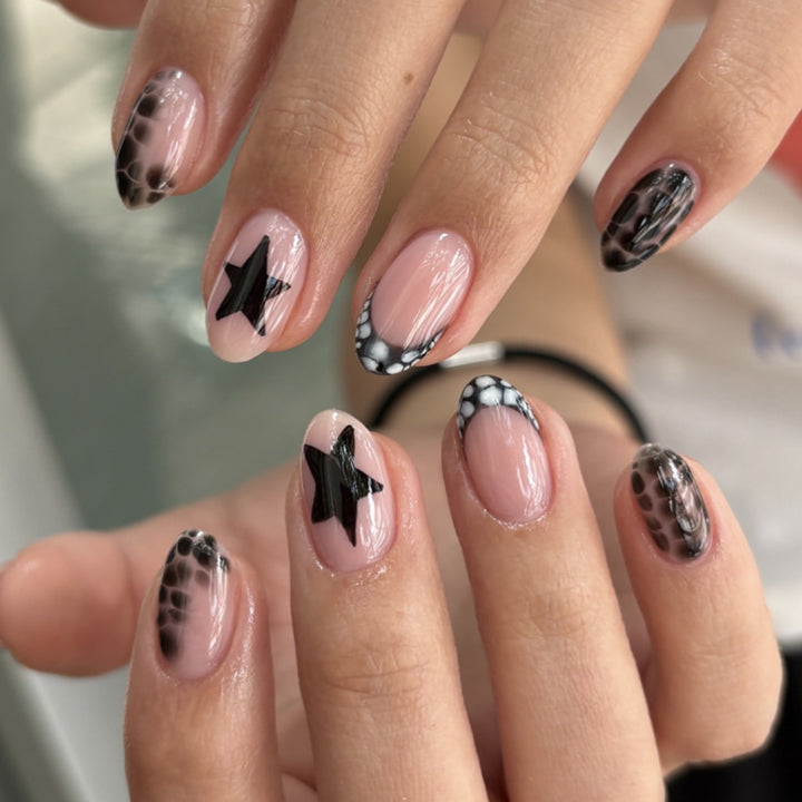 Creative nail art with shimmering star motifs Stornfield