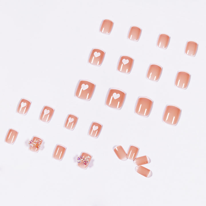 Nail art with heart and butterfly motifs Stornfield