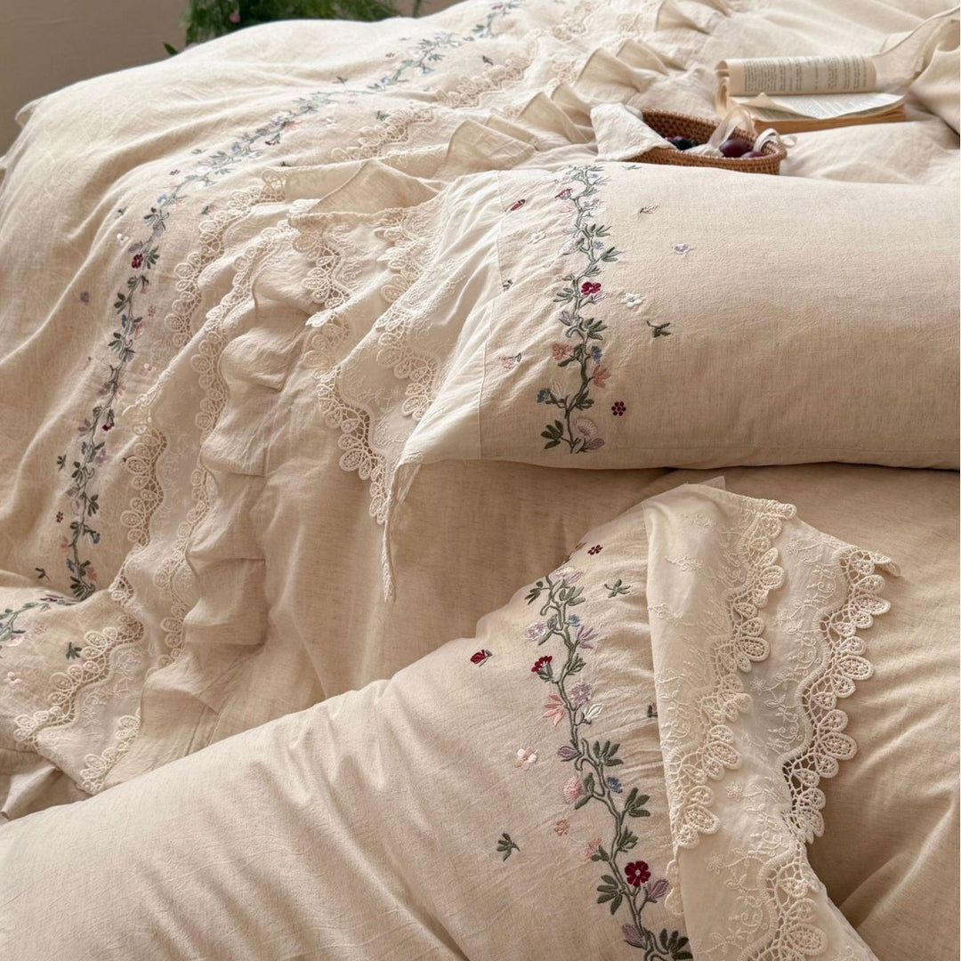 Romantic bedding set made of linen look with floral embroidery, lace trim and frill