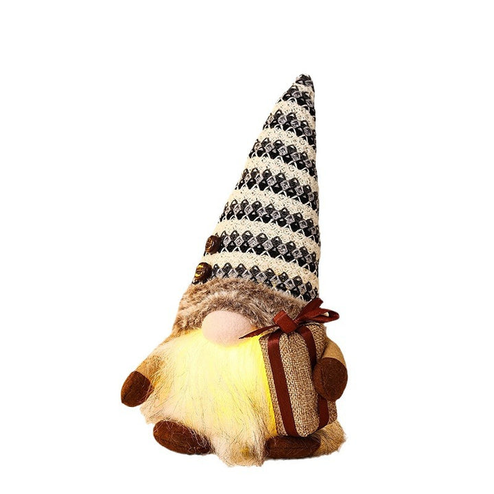 Decorative Christmas gnome with gift package Stornfield