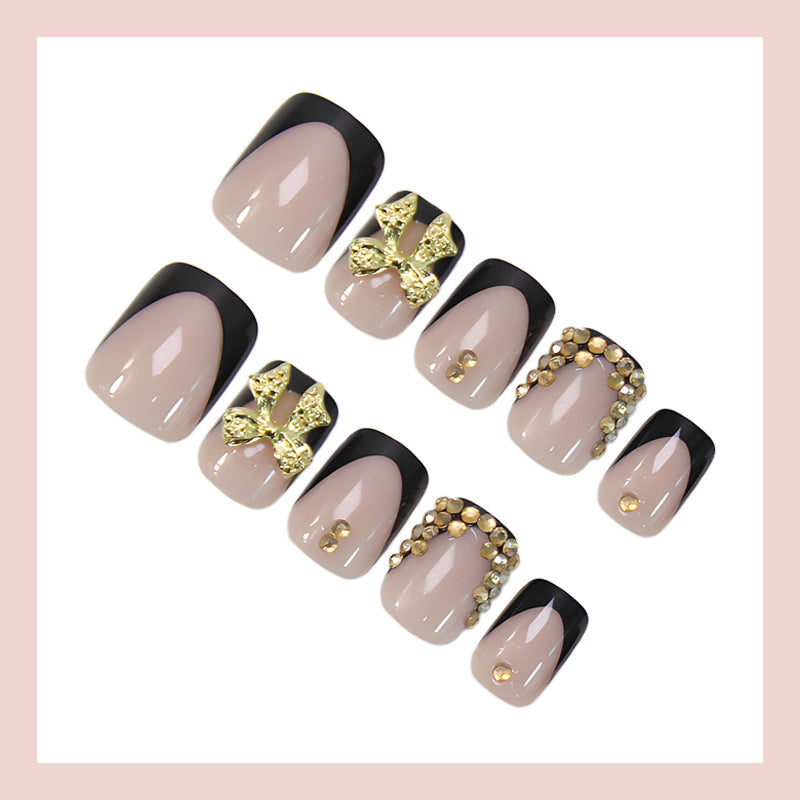 Artificial nail set with elegant black tips and sparkling accents Stornfield