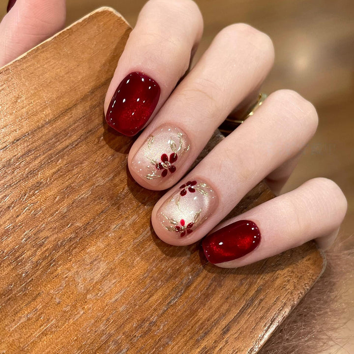 Artificial nails with elegant floral and glitter designs Stornfield