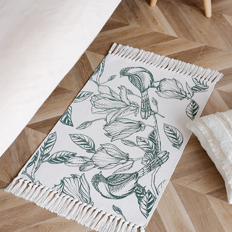 Woven table runner with botanical bird print and decorative fringes