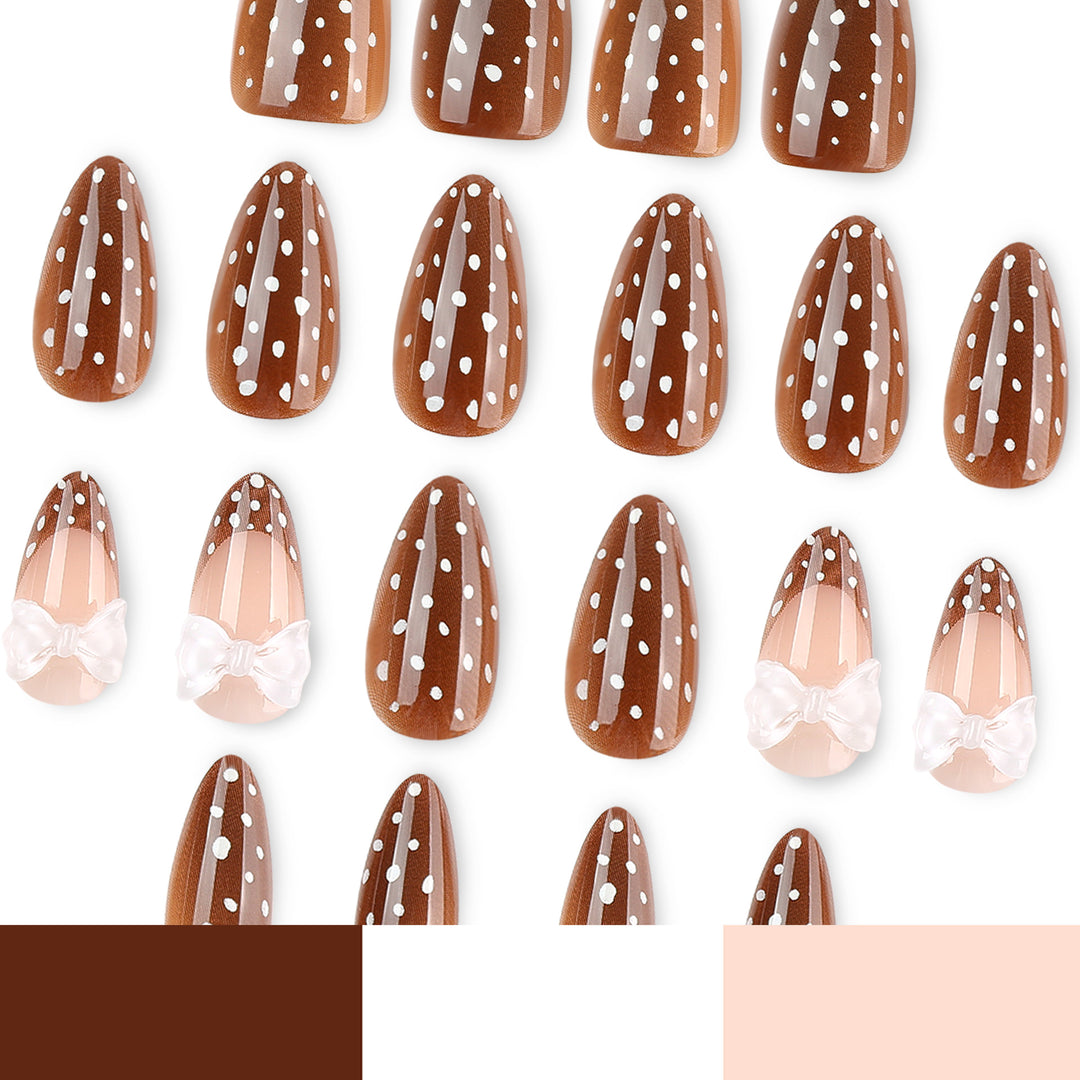 Artistic stiletto nails with delicate bow motif Stornfield