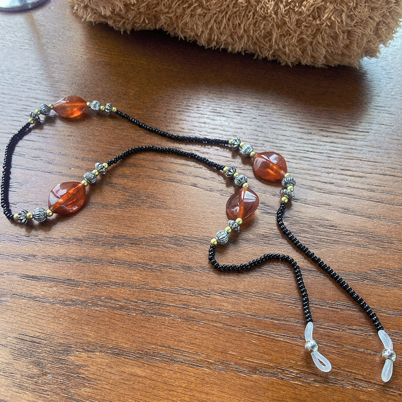 Stylish glasses holder chain with colorful accents Stornfield