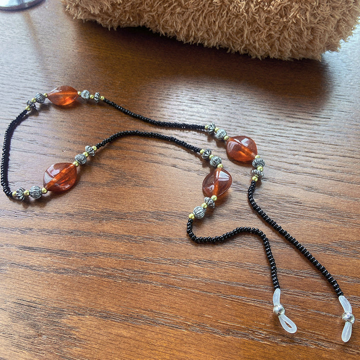 Stylish glasses holder chain with colorful accents Stornfield