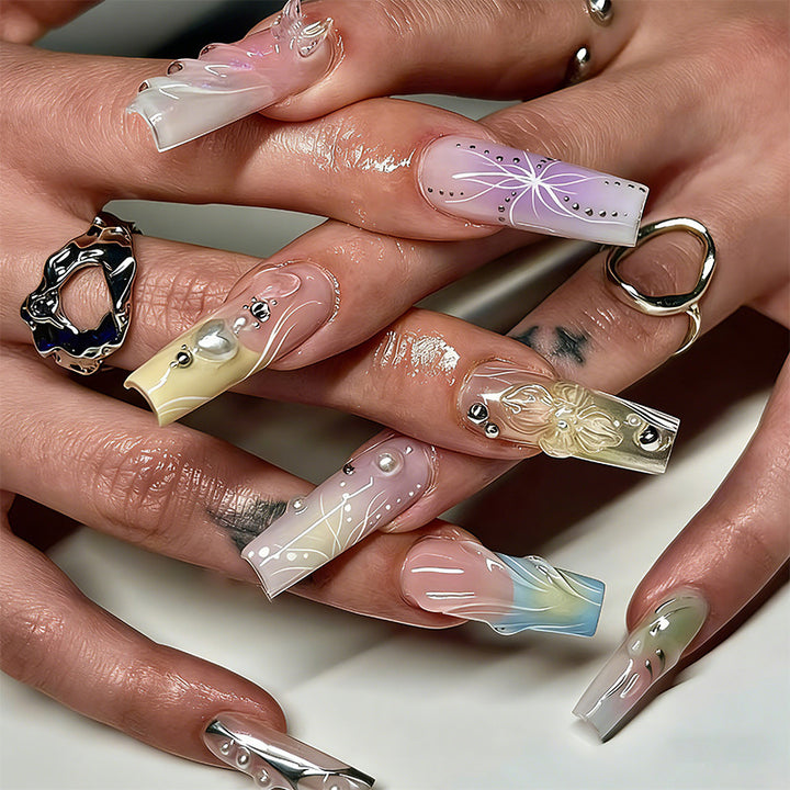Artificial nail set with elegant floral and sparkling accents Stornfield